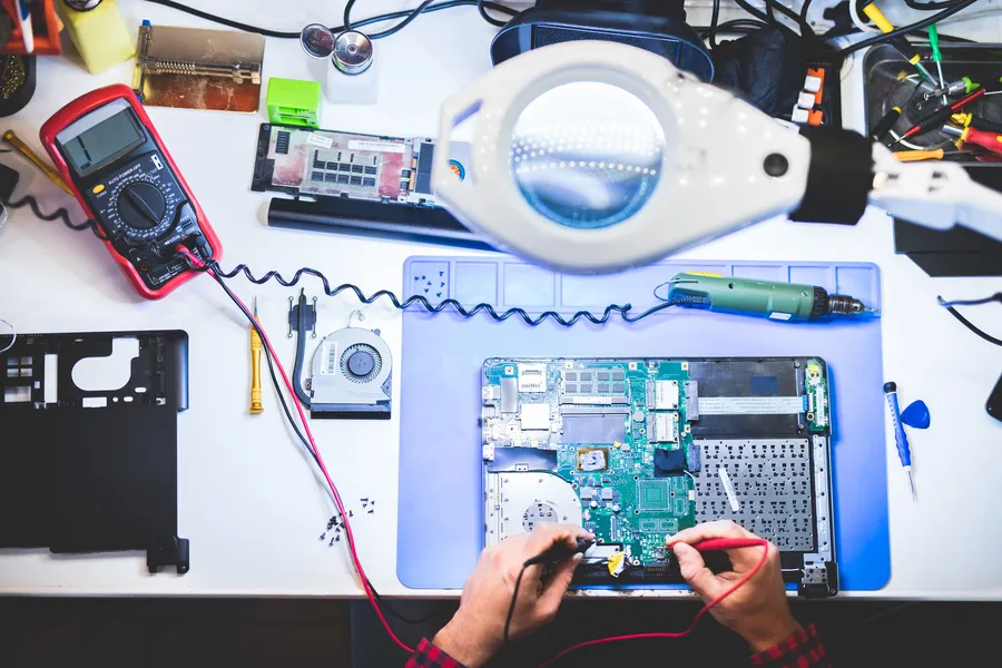 Engineer working at an electronics bench